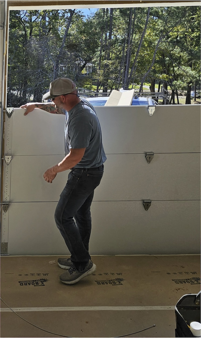 Jonathan putting in a new garage door